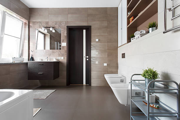 istock Spacious bathroom in brown tones 589445692