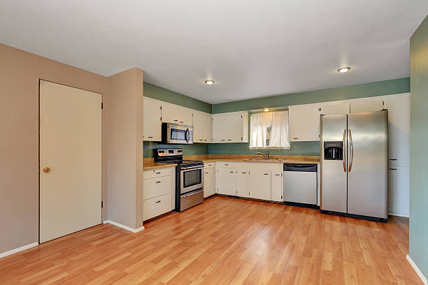 istock Remodeled kitchen with stainless steel appliances. 589446120