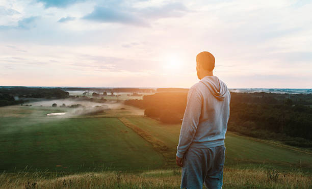 istock Runner looks at scenic view at sunset 589446774
