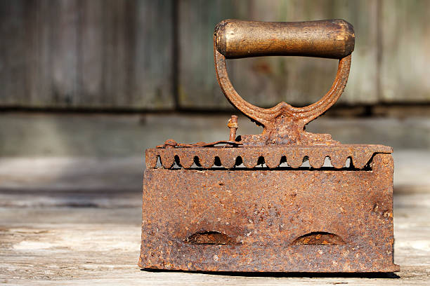 istock Old vintage iron on coals 589450294