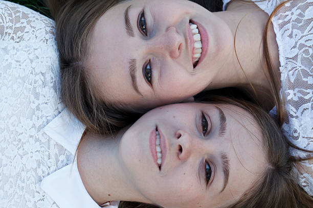 istock people emotions, charming sisters twins 589450552
