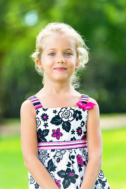 Beautiful caucasian little girl posing looking at the camera