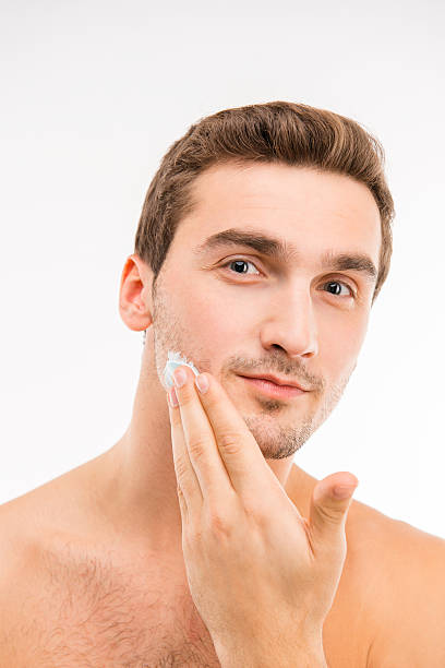 istock young handsome man with shaving cream on his cheek 589452558