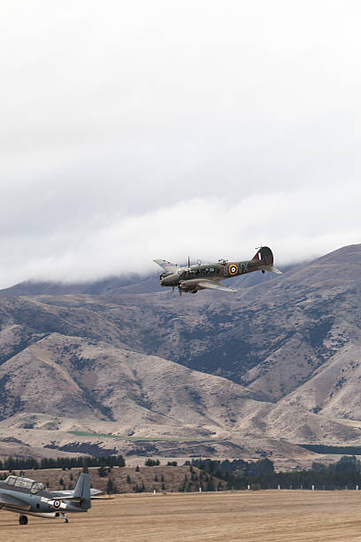 British warplanes flying over at Warbirds Wanaka, New-Zealand - April 18, 2014: British warplanes flying at Warbirds over Wanaka Airshow spitfire stock pictures, royalty-free photos & images