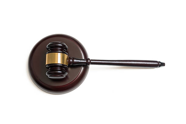 istock Top view on wooden gavel isolated on white background. 589458686