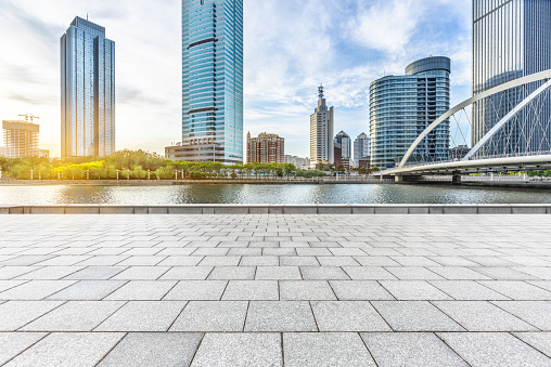 empty pavement and modern buildings in city,China.