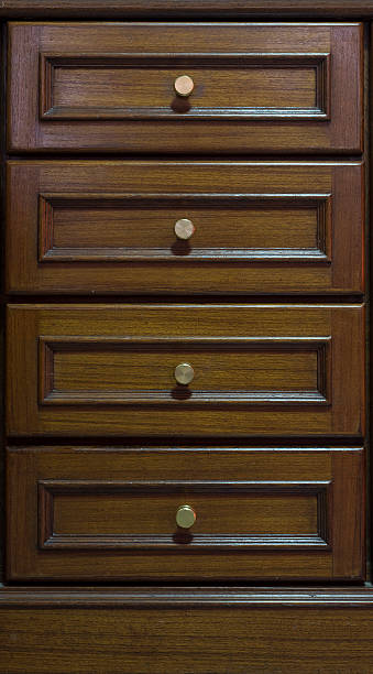 istock Cabinet with drawers made from dark wood 589459096