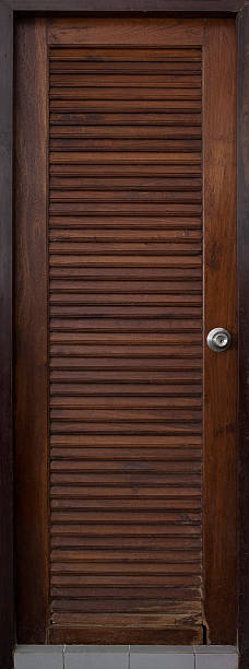 istock Old wood door with louvers, retro abstract background 589459116