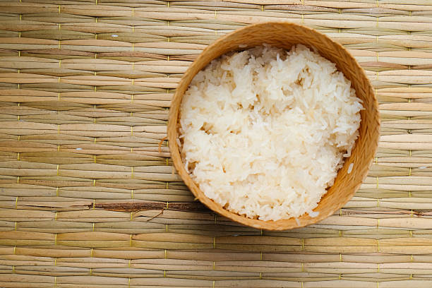 istock Sticky rice in a bamboo wooden old style box 589459456
