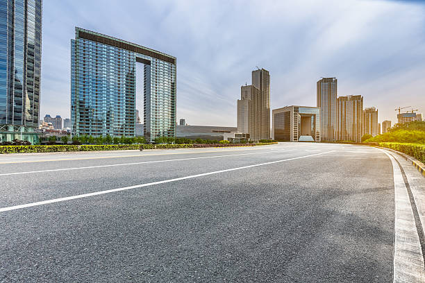 istock empty road front of modern buildings 589459550