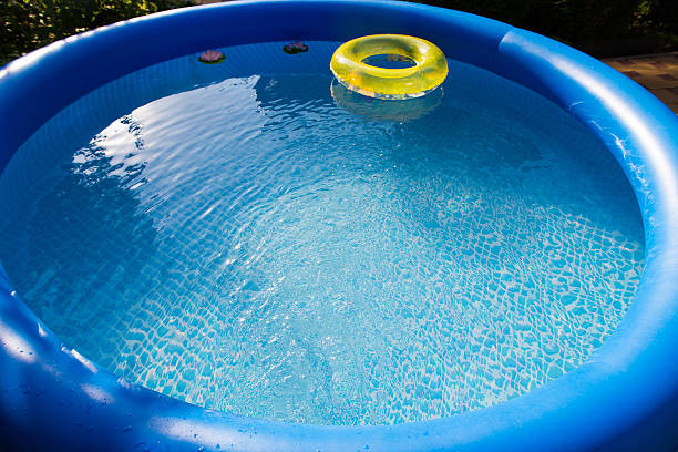 istock Outdoor blue inflatable pool with water 589460160