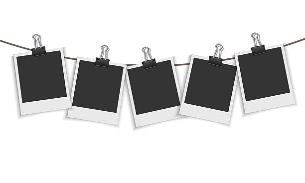 Blank photo frame hanging on a line with paper clip Vector EPS 10 format. clothespin stock illustrations