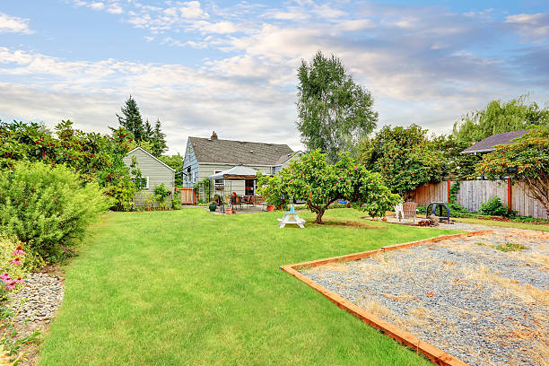 istock Grass filled garden with patio area in the back yard 589537738