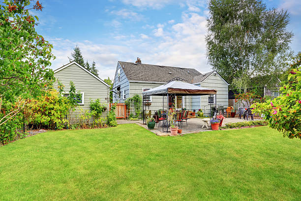 Grass filled garden with patio area in the back yard. Northwest, USA