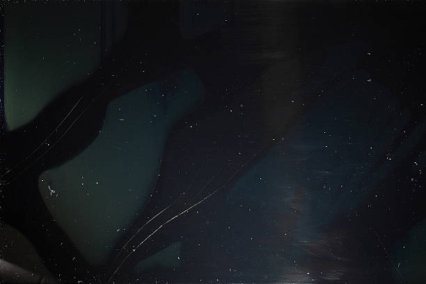 Old dusty black digital screen with cracks Old dusty black digital screen with cracks. Broken screen of smartphone, tablet, laptop, tv-set monitor close-up. Damaged device background black glass surface stock pictures, royalty-free photos & images