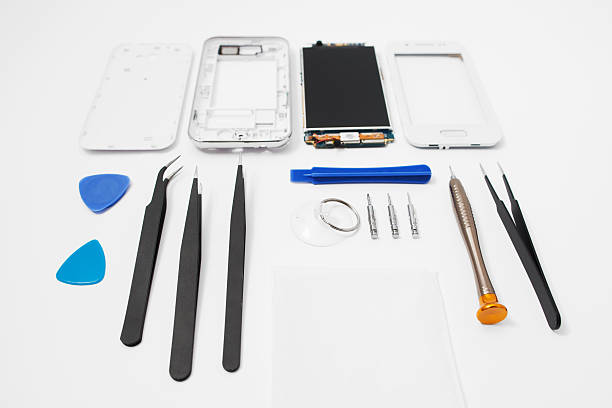 istock Repairman workplace with phone and tools 589538506