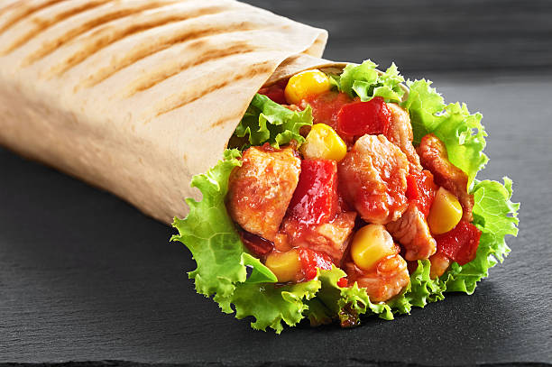 istock Burrito with grilled chicken and vegetables 589538904