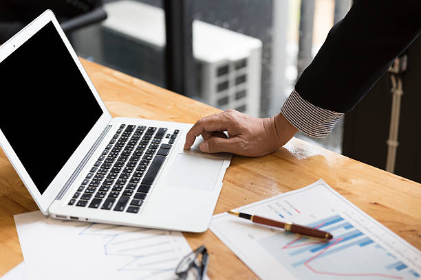 istock businessman in suit analyse market analysis business chart with computer 589539938