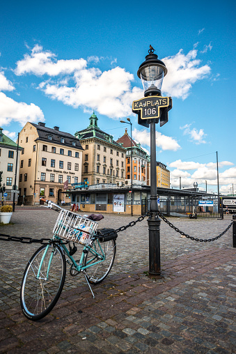Stockholm, Sweden - July 31, 2016: Bicycle parked on embankment in Gamla stan, Stockholm