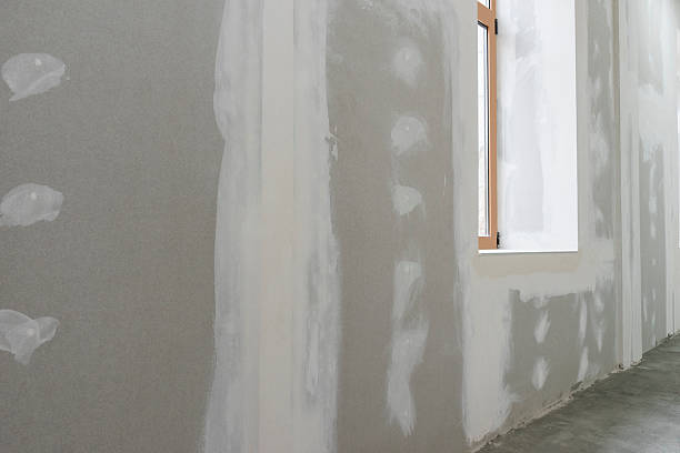istock Unfinished wall with window in apartment 589541904