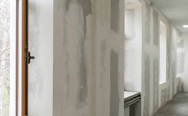 istock Unfinished walls with windows in apartment 589542912