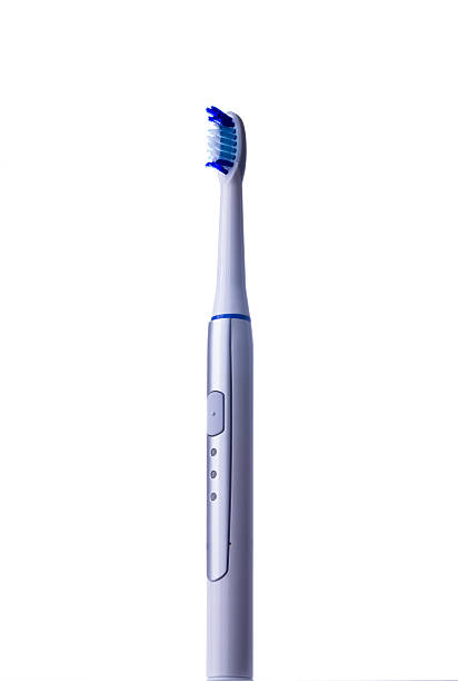 istock Electric toothbrush isolated on white background vertical positi 589544262