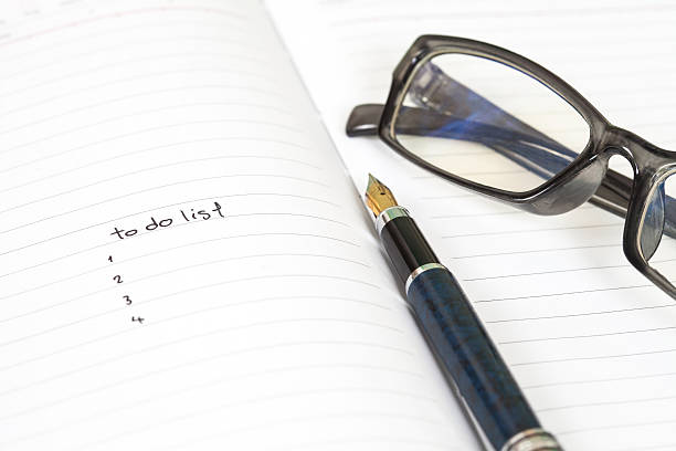 istock writing to do list on notebook page with pen 589544352