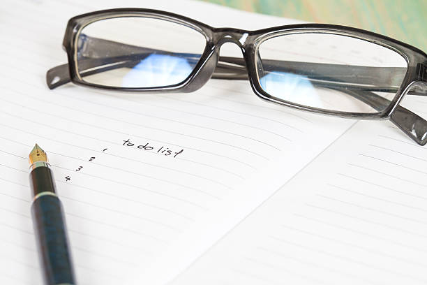 istock writing to do list on notebook page with pen 589544472