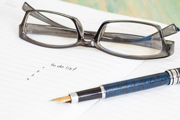 istock writing to do list on notebook page with pen 589544546