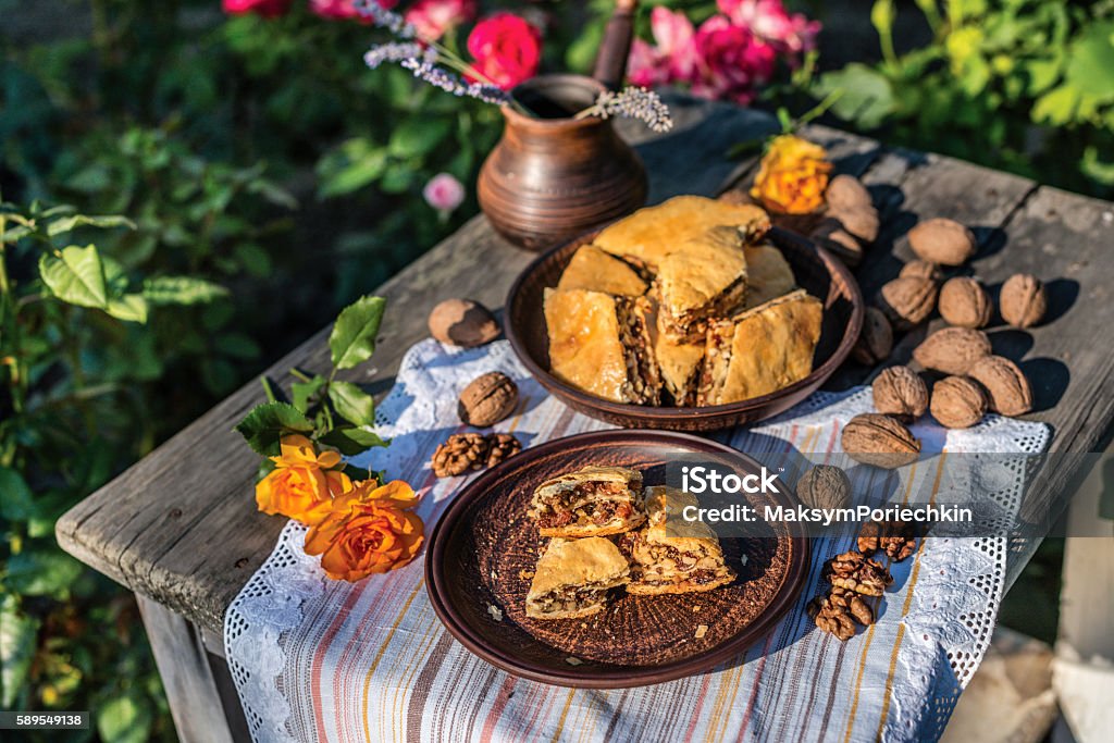 Arab sweets. Pieces of walnut pakhlava is on a clay - Royalty-free Ahşap Stok görsel