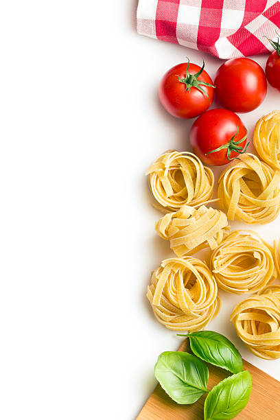 istock italian pasta tagliatelle, tomatoes and basil leaves 589549198