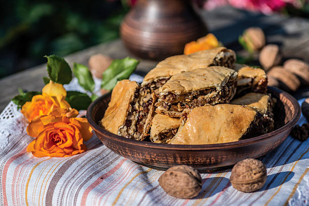 istock Arab sweets. Pieces of walnut pakhlava is on a clay 589549618