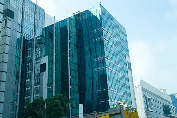 istock Low angle view of office buildings against sky 589549634