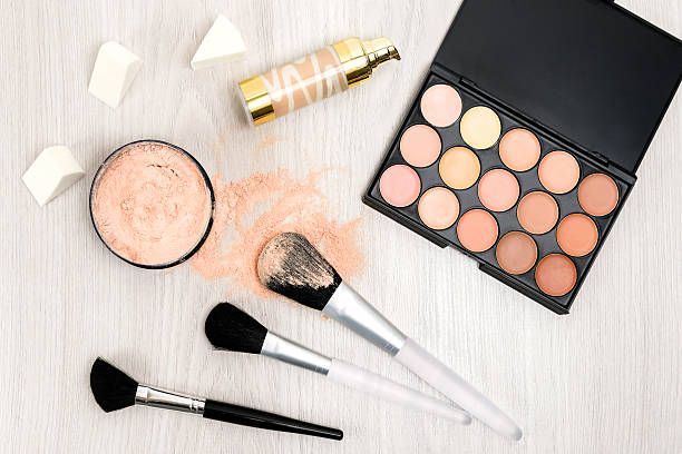 istock Makeup products on wooden background 589551936