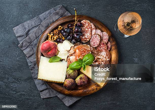 Italian Antipasti Snack For Wine On Wooden Tray Dark Background Stock Photo - Download Image Now