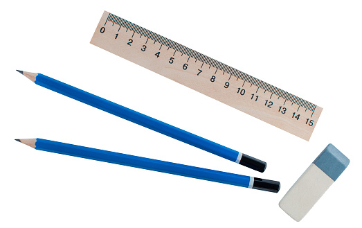 stationery - ruler, eraser and two simple pen are on a white, isolated background