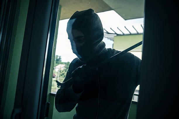 istock Burglar breaks into a residential building 589553494