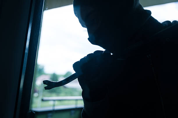 istock Burglar breaks into a residential building 589553700