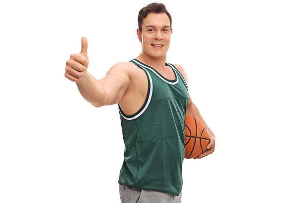 istock Man holding a basketball 589554320