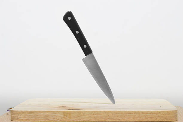 istock Knife on the cutting board with white background 589556676