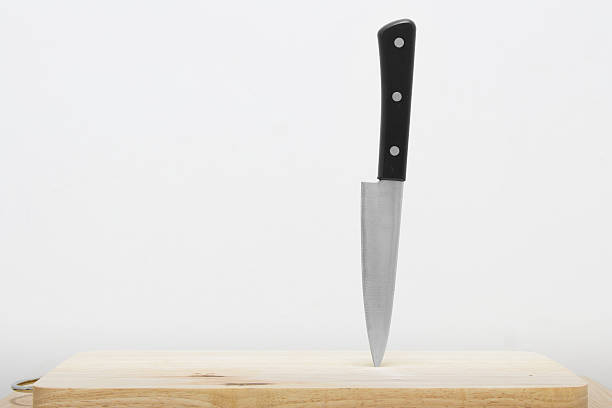 istock Knife on the cutting board with white background 589556802