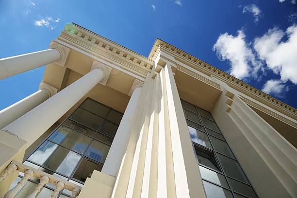 roof, windows and columns of new building on blue sky - government building imagens e fotografias de stock