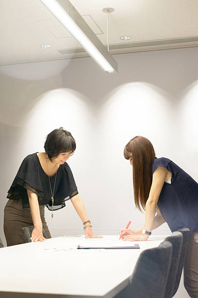 istock Businesswomen Working Together 589560878