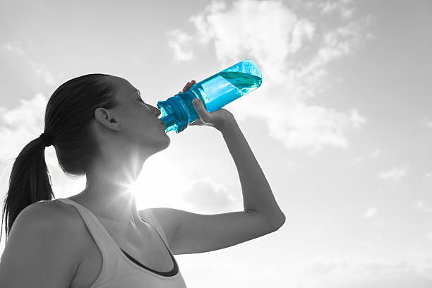 istock Woman drinking water 589561724