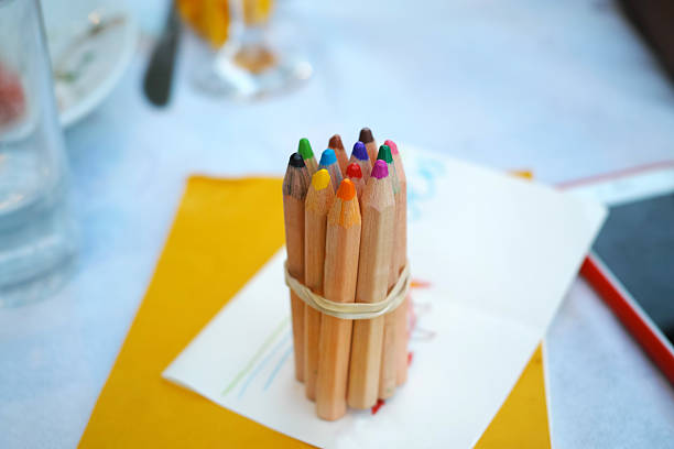 istock Small Vibrant Pencils All Tied Together Placed on The Table 589562226