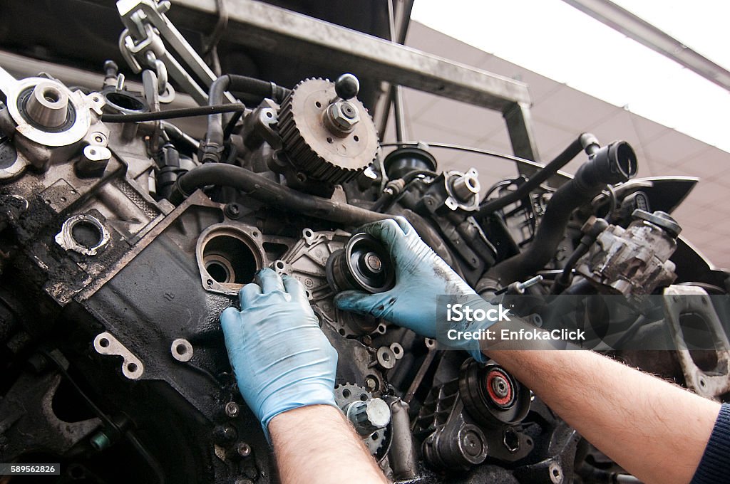 Car mechanic working/repairing the engine Repair Garage, Car, Mechanic, Car Mechanic, Workshop Auto Mechanic Stock Photo