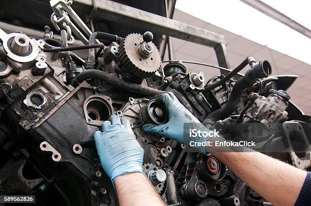 Car Mechanic Workingrepairing The Engine Stock Photo - Download Image Now - Auto Mechanic, Car, Repairing