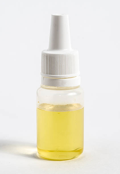 istock bottle of e-liquid for electronic cigarette on white background 589563522