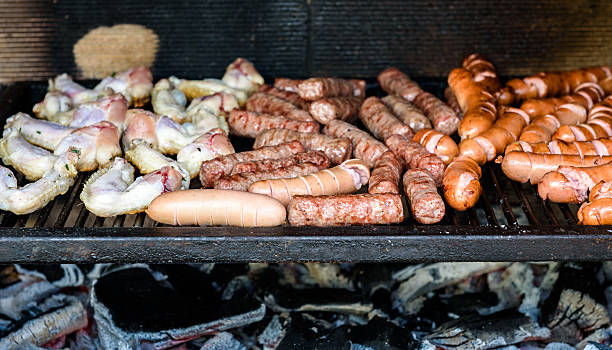 istock Mixed Meat on barbecue grill with coal. 589563816