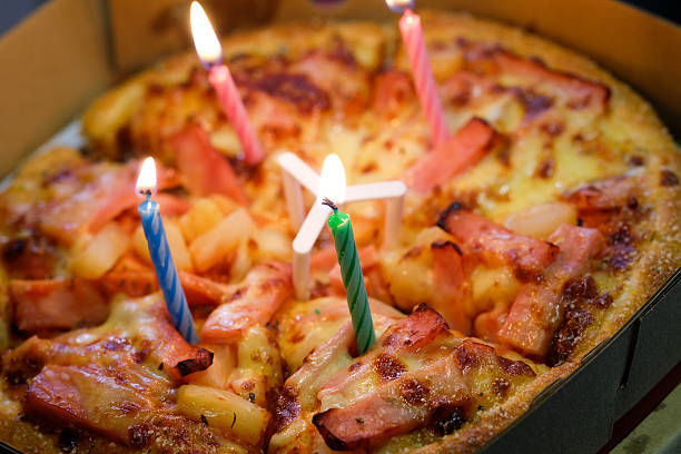 Pizza with candles to celebrate a birthday ,with selective focus